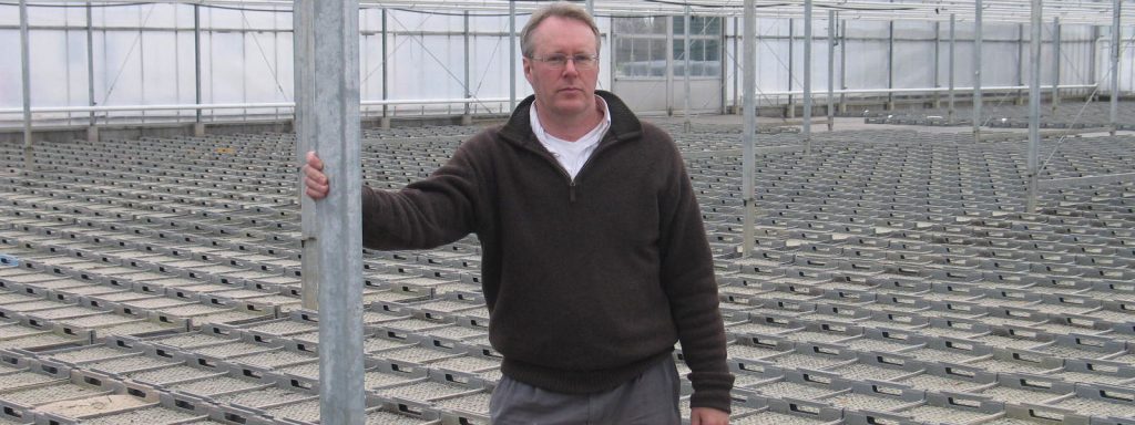 James Bean of Crystal Heart Salad in greenhouse