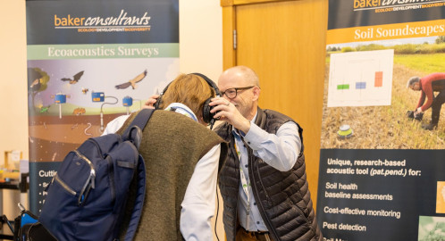 Photo of Baker Consultants showing a farmer their bioacoustics