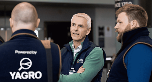 Photo of three farmers talking